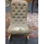 An Edwardian rocking chair with buttoned padded back