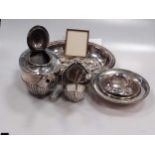 A silver three piece tea set and a small quantity of silver flatware, 29.2ozt gross, together with a