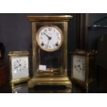 A gilt brass mantel clock by Ansonia Clock Co., New York, with bevelled glass sides and compensating
