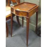 An Edwardian mahogany occasional table with 3/4 gallery back, on square tapered legs and spade feet,