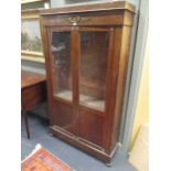 A French mahogany Empire display cabinet with ormolu mounts and a pair of glazed doors 191 x 114 x