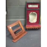 Late Victorian wall mirror with bevelled plate, and shelf below, and a walnut folding book stand (