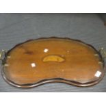 A mahogany kidney shaped tray