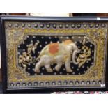 An Indian raised embroidery elephant picture on a dark ground, with silvered and gilt thread,