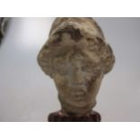 A carved marble Greek head of a goddess wearing a helmet, 15cm high