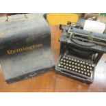 An early 20th century Remington typewriter, an early 20th century bamboo book grabber and other
