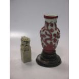 A Pekin type glass vase, 16cm high, on carved wooden stand, 21.5cm high; and a soapstone seal 12cm