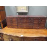 A mid 19th century mahogany bank of 14 drawers 30cm high, 93cm wide
