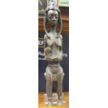 Modern wood carved African figure of a seated maternal figure (Dimensions: 118 cm high)(118 cm
