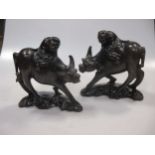 Pair Chinese wire inlaid wood “boy on buffalo” groups, early 20th