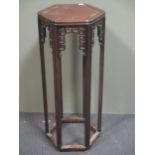 An early 20th century Chinese hardwood jardiniere stand.