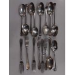 A collection of early to mid 18th century silver flatware