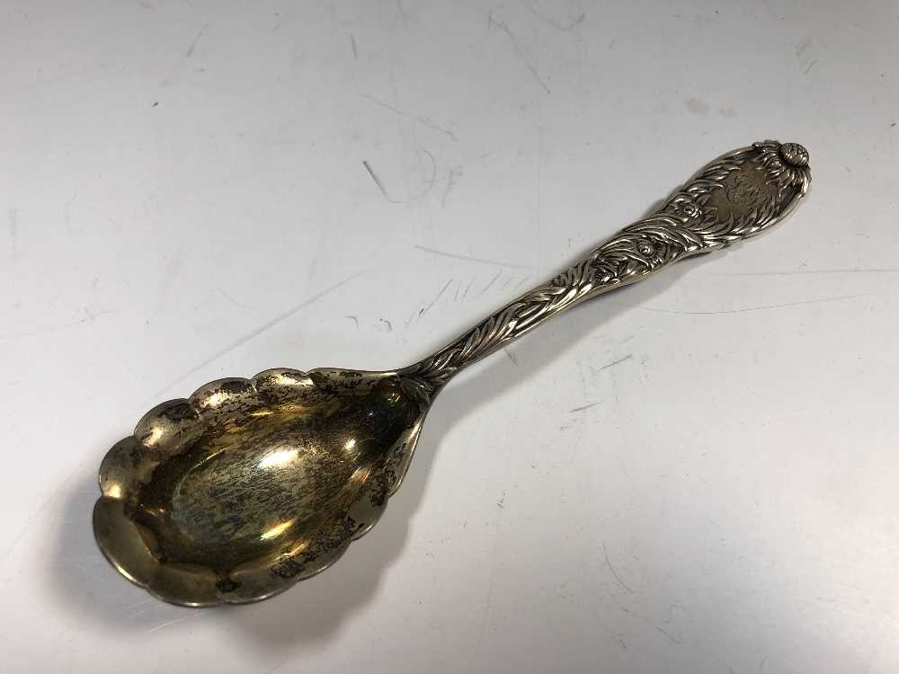 An American metalwares conserve spoon by Tiffany,