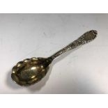 An American metalwares conserve spoon by Tiffany,