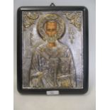 A modern Greek Orthodox white metal and gold plated reproduction of a Byzantine icon