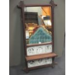 A Gothic style oak wall mirror, decorated with six Minton tiles depicting Shakespearian scenes