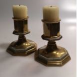 A quantity of small brass table easels; a pair of 19th century miniature candlesticks, of tripartite