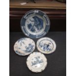 A pair of 18th century blue and white creamware plates, decorated with a cottage in a landscape,