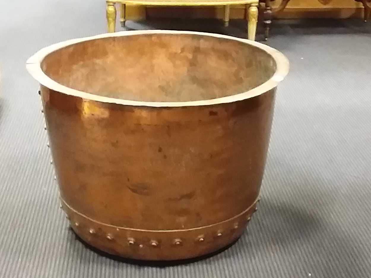 A large copper log bucket