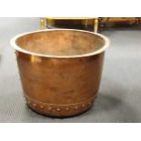 A large copper log bucket