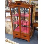 A Edwardian satinwood display cabinet with shaped pierced cornice and arched beaded doors 182 x 91 x