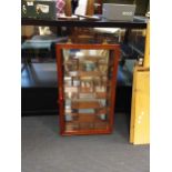 A modern Oriental glazed hardwood wall mounted display cabinet, 76x46x10cm