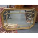 A George III style octagonal gilt wood wall mirror, moulded in compartments, with egg and dart frame