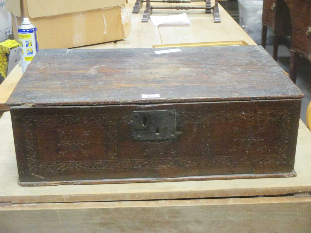 A late 17th century early 18th century elm bible box with simple geometric scratched decoration