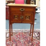 An art nouveau satinwood small side table with a pair of inlaid doors under drawer 69 x 59 x 33"