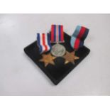A WW2 three medal set with box and paperwork comprising the France and Germany star, the 39/45