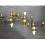 Three brass two-branch wall lights, in 17th century style