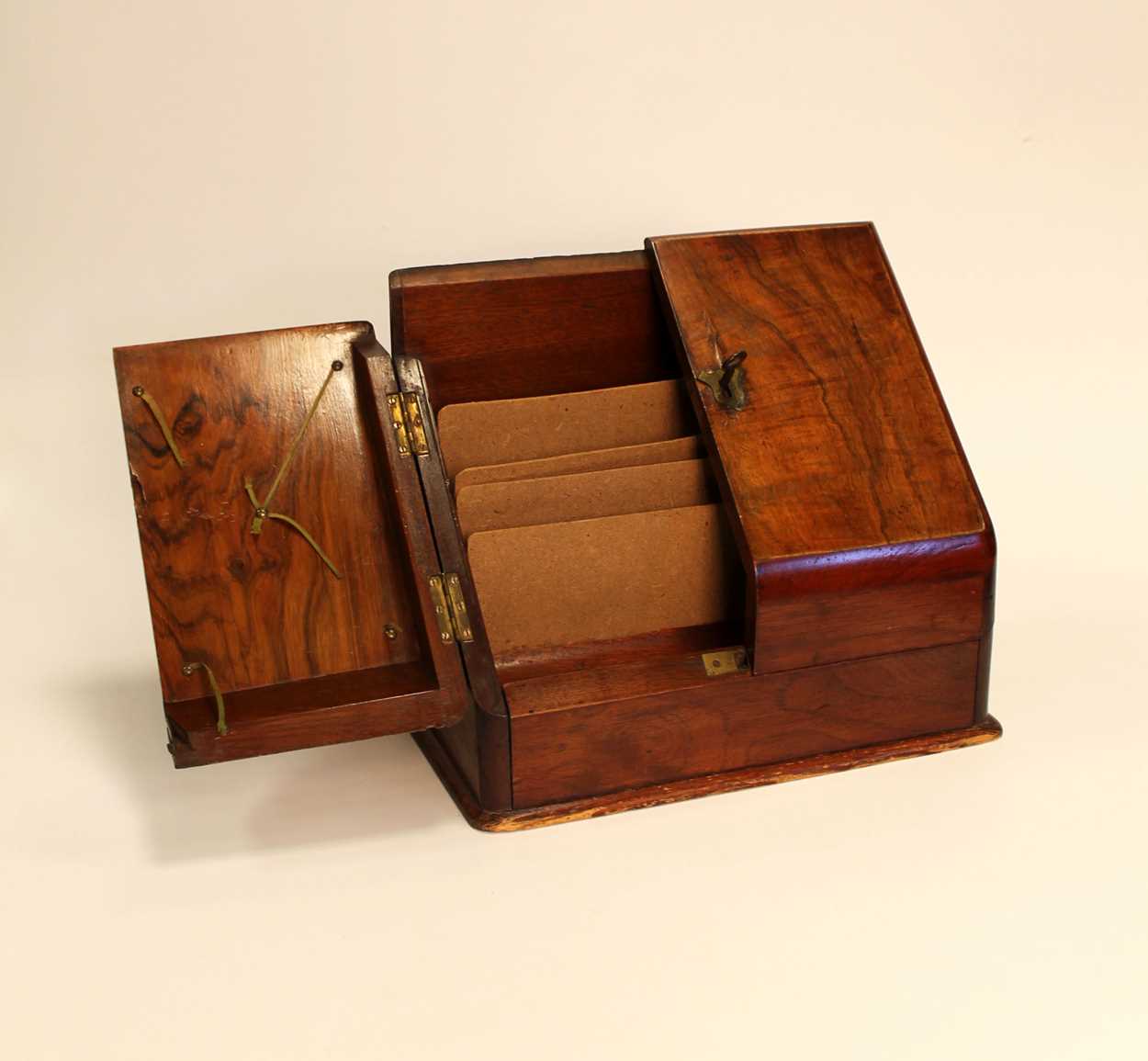 A Victorian walnut stationery box with opening front