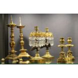 A pair of 19th century bronze and brass candlesticks,