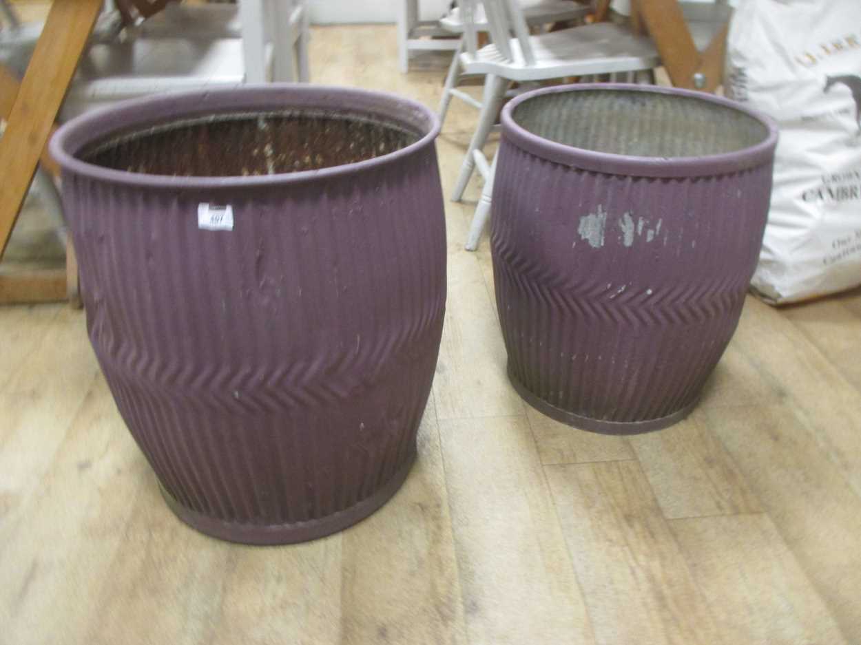 A 20th century terracotta urn 69cm high together with two purple painted metal planters (3) - Image 2 of 2