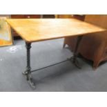 A worktable with cast iron stand, 77 x 121 x 68cm
