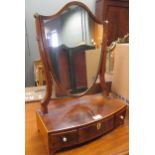 A Regency mahogany shield shaped toilet mirror; together with an oval shaped toilet mirror (2)