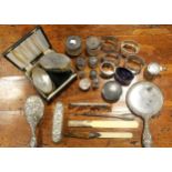 A quantity of small silver items to include a brush set, bottles etc