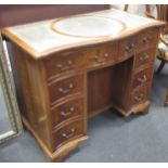 A Regency style mahogany kneehole desk with grey leather inset top, 76 x 92 x 53cm