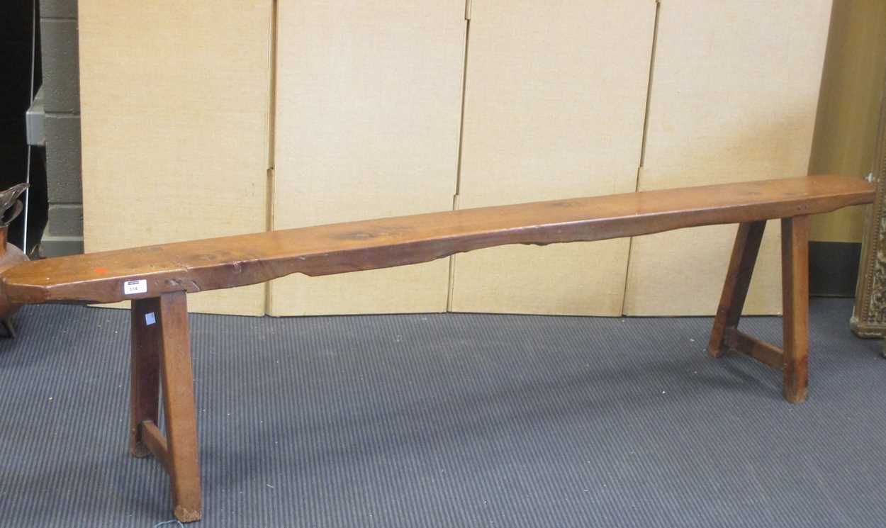 A 19 th century yew wood bench, 44.5 high x 197 wide x 17 deep