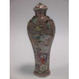 A 19th century Chinese porcelain vase and cover decorated with figures and animals in a garden