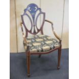 A late 19th century painted satinwood armchair in the manner of Wright & Mansfield
