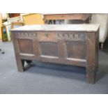 A small oak coffer made from old panels, 61 x 38 x 108cm