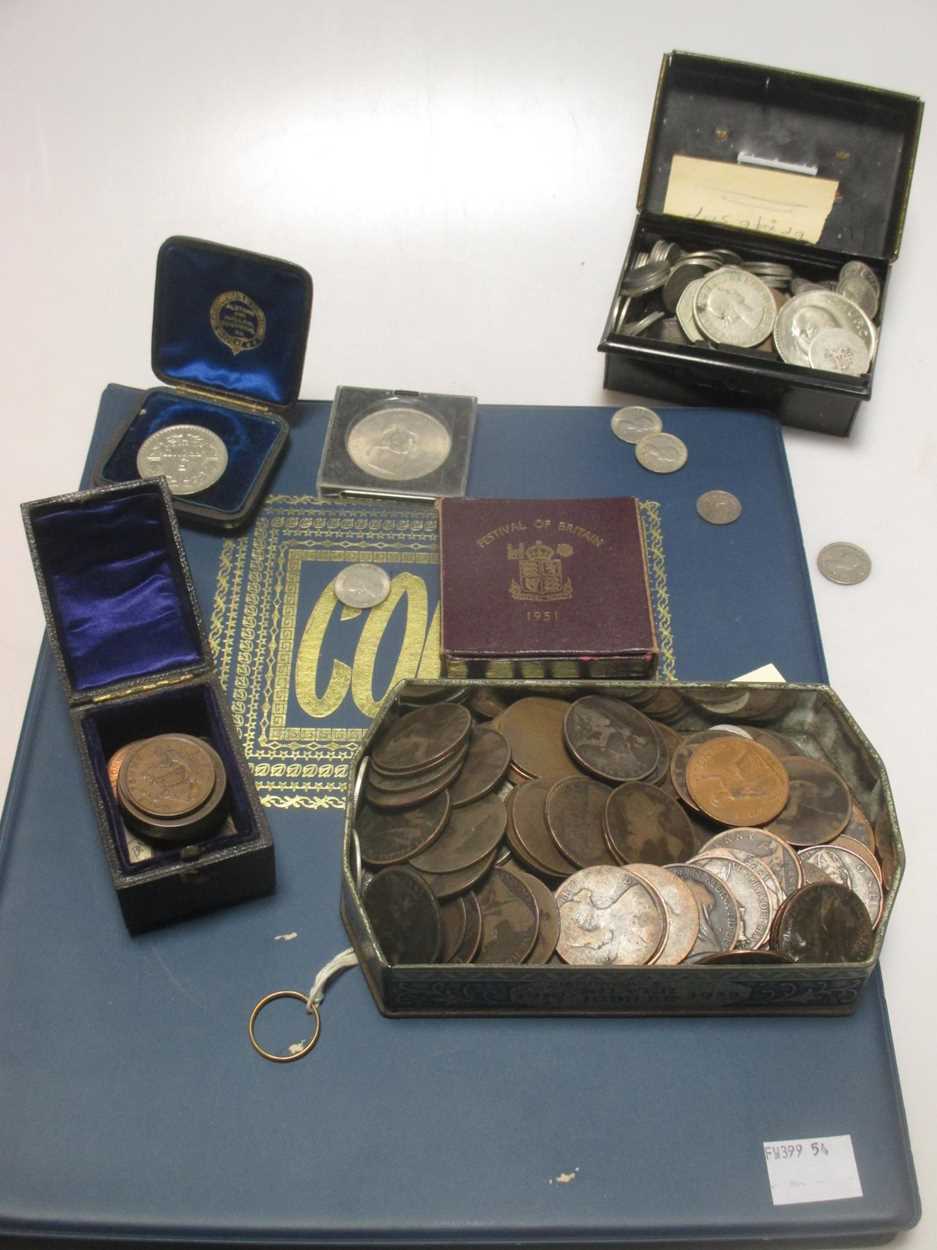 A quantity of miscellaneous coins and a gold wedding band