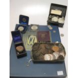 A quantity of miscellaneous coins and a gold wedding band