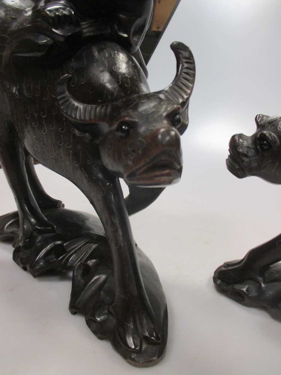 A pair of early 20th century Chinese wire inlaid wood “boy on buffalo” groups, - Image 4 of 4