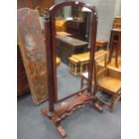 A Victorian mahogany cheval mirror on turned supports and shaped platform base, 167 x 83cm