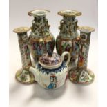 A pair of Cantonese vases and candlesticks; together with a teapot (damages) (5)
