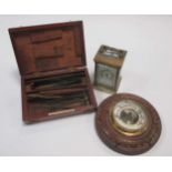 An Edwardian brass carriage clock, aneroid barometer and medical kit