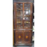 A Sheraton revival mahogany and satinwood crossbanded floor standing corner cabinet, 205 x 89cm