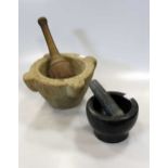 A late 18th century marble pestle and mortar and a modern granite pestle and mortar (2)